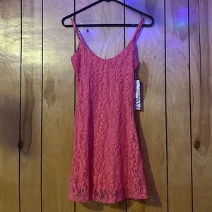 Want it. Wear it. Love it. Short Lace Bright Pink Dress.